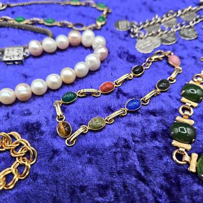 LOT 57J: Multiple Bracelets Including Sarah Coventry, Ten Commandments Charm Bracelet, Trifari Necklace, and More
