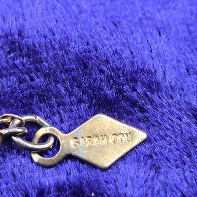 LOT 57J: Multiple Bracelets Including Sarah Coventry, Ten Commandments Charm Bracelet, Trifari Necklace, and More