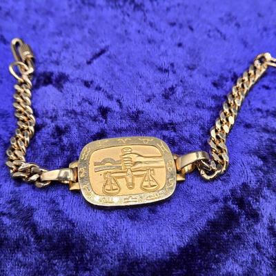 LOT 57J: Multiple Bracelets Including Sarah Coventry, Ten Commandments Charm Bracelet, Trifari Necklace, and More