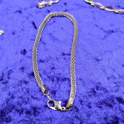 LOT 57J: Multiple Bracelets Including Sarah Coventry, Ten Commandments Charm Bracelet, Trifari Necklace, and More