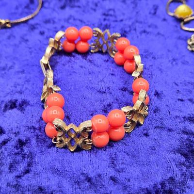 LOT 57J: Multiple Bracelets Including Sarah Coventry, Ten Commandments Charm Bracelet, Trifari Necklace, and More