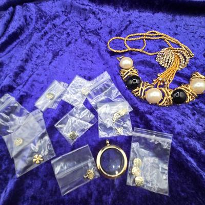 LOT 59J: Gold Tone Rope Necklace with Rhinestone Cluster and Waterfall Strands, Glass Charm Holder Pendant with Assorted Charms, and...