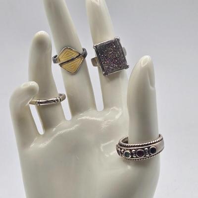LOT 102J: Four Sterling silver Rings / 22.1 gtw