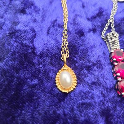 LOT 113J: Multiple Necklaces, One with Matching Earrings