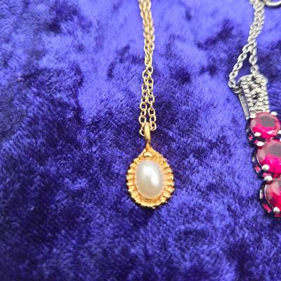 LOT 113J: Multiple Necklaces, One with Matching Earrings