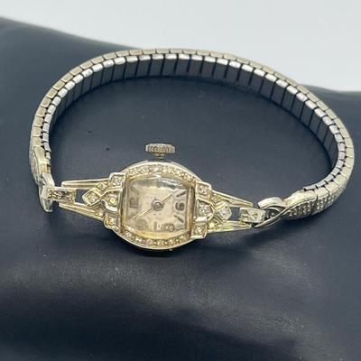 LOT 121: 14K Solid White Gold Ladies Watch (Not Working) w/ Diamonds on Speidel Stretch Band