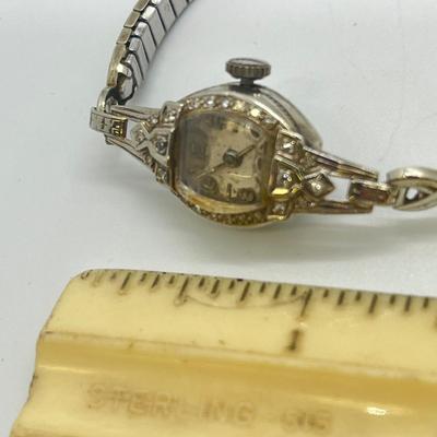 LOT 121: 14K Solid White Gold Ladies Watch (Not Working) w/ Diamonds on Speidel Stretch Band