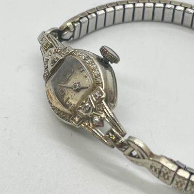 LOT 121: 14K Solid White Gold Ladies Watch (Not Working) w/ Diamonds on Speidel Stretch Band