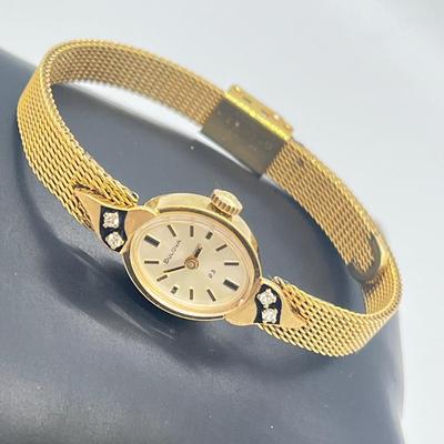LOT 12: 14K Gold Bulova Ladies Watch w/ Diamonds on Gold Filled Band - Winds and Ticks