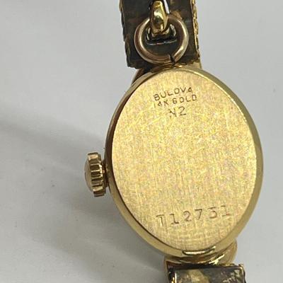 LOT 12: 14K Gold Bulova Ladies Watch w/ Diamonds on Gold Filled Band - Winds and Ticks