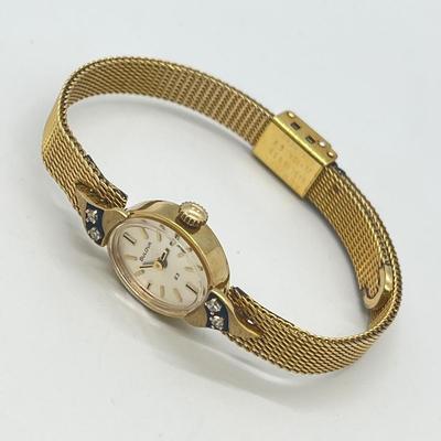 LOT 12: 14K Gold Bulova Ladies Watch w/ Diamonds on Gold Filled Band - Winds and Ticks