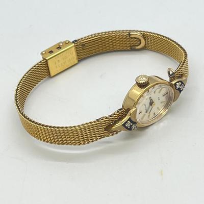 LOT 12: 14K Gold Bulova Ladies Watch w/ Diamonds on Gold Filled Band - Winds and Ticks