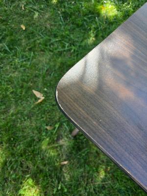 Folding wood grain table with 4 folding chairs