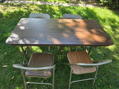 Folding wood grain table with 4 folding chairs