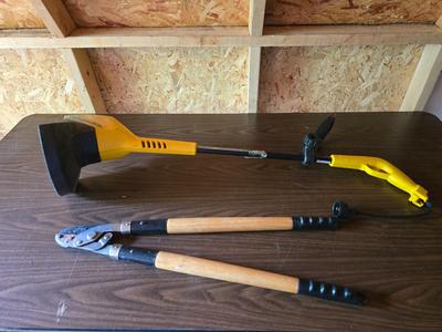 Electric weed eater, Loppers, and a bow saw