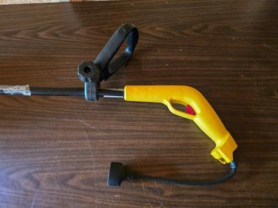 Electric weed eater, Loppers, and a bow saw