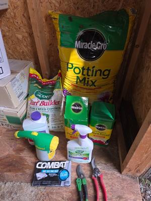 Lawn and Garden supplies and chemicals with a true temper spreader