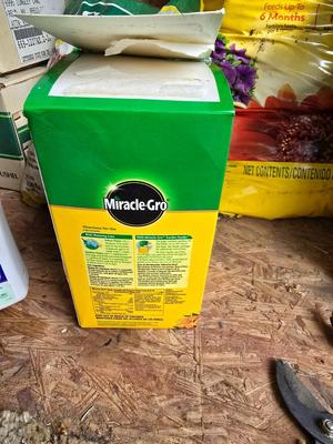 Lawn and Garden supplies and chemicals with a true temper spreader