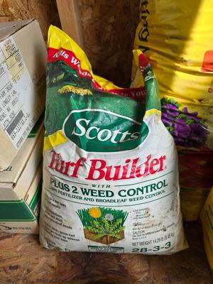 Lawn and Garden supplies and chemicals with a true temper spreader