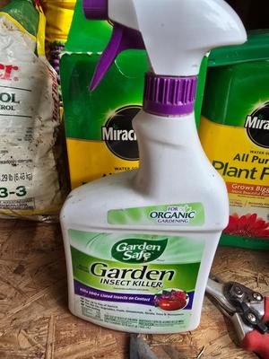 Lawn and Garden supplies and chemicals with a true temper spreader