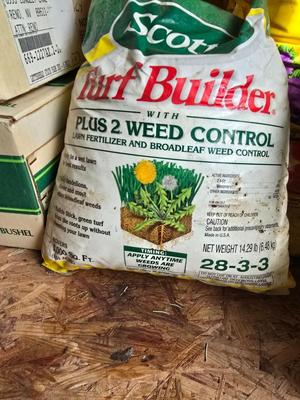 Lawn and Garden supplies and chemicals with a true temper spreader