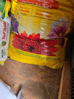 Lawn and Garden supplies and chemicals with a true temper spreader