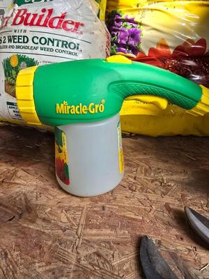 Lawn and Garden supplies and chemicals with a true temper spreader