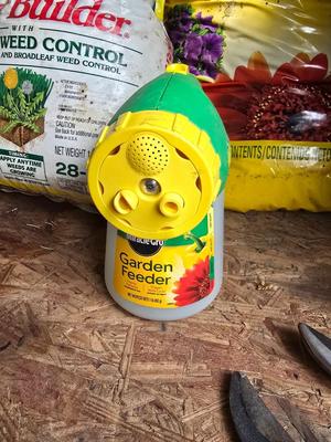 Lawn and Garden supplies and chemicals with a true temper spreader