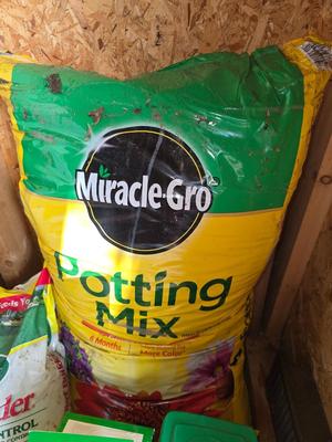 Lawn and Garden supplies and chemicals with a true temper spreader