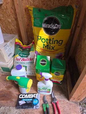 Lawn and Garden supplies and chemicals with a true temper spreader