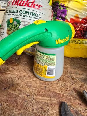 Lawn and Garden supplies and chemicals with a true temper spreader