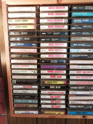 VARIETY OF CASSETTE TAPES AND WOODEN HOLDER