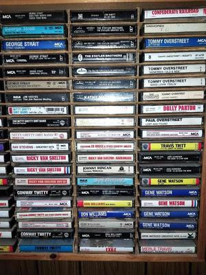 VARIETY OF CASSETTE TAPES AND WOODEN HOLDER