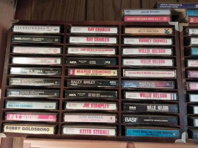 VARIETY OF CASSETTE TAPES AND WOODEN HOLDER