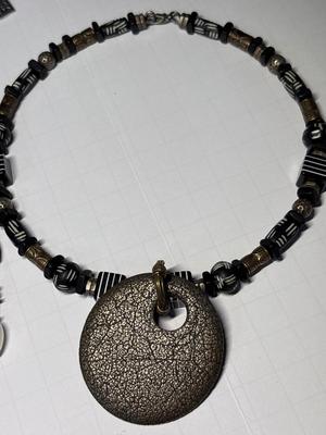 4 black-tone necklaces