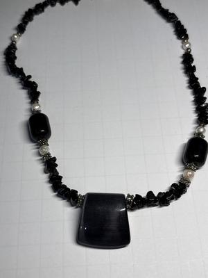 4 black-tone necklaces