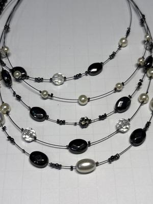 4 black-tone necklaces