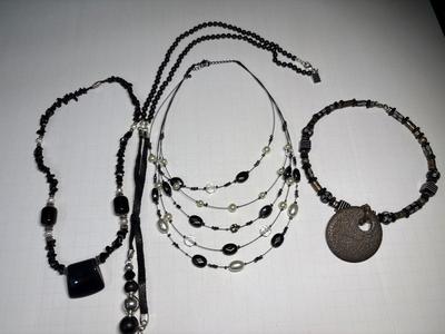 4 black-tone necklaces