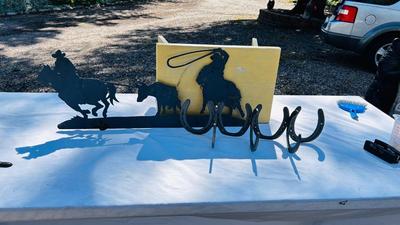 HORSESHOE COAT HOOKS AND A COWBOY IRON WALL CUTOUT