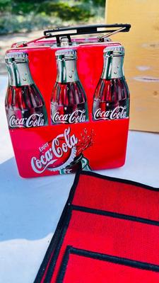 COCA-COLA PLACEMATS, PLASTIC PLATES, AND BOTTLE SHAPED TIN