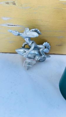WILEY COYOTE HOOD ORNAMENT, YOSEMITE SAM LICENSE PLATE SWAG, AND SINCLAIR OIL CAN