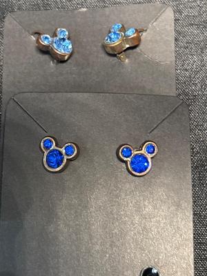 Mickey Mouse earrings, pin, and bracelet