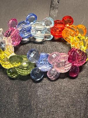 Mickey Mouse earrings, pin, and bracelet