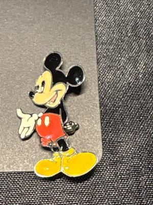 Mickey Mouse earrings, pin, and bracelet