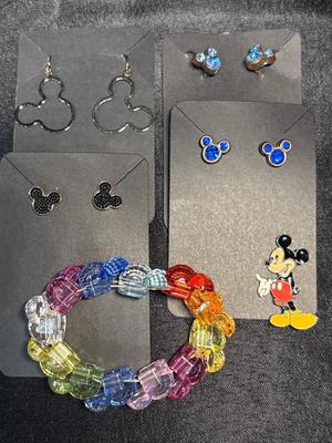 Mickey Mouse earrings, pin, and bracelet