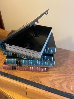 VHS tapes, holder, and book-like cases
