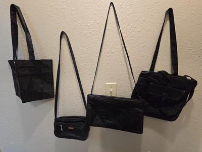 Four black purses