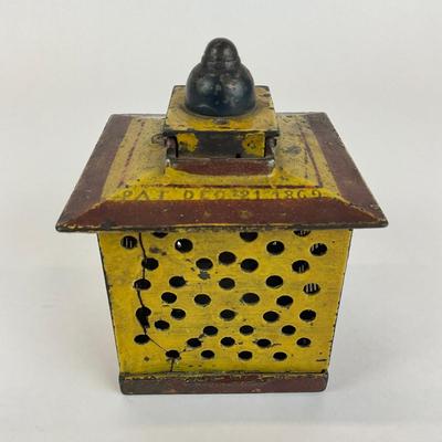 Sale Photo Thumbnail #1029: Designed By John Hall, patent 1869
Lady is missing head
Measures: 4" x 4" x 5" high