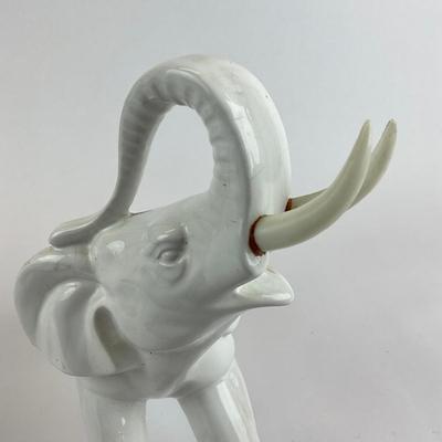 Sale Photo Thumbnail #1052: Tusks have been glued back in
Both measure: 13" long x 10" high