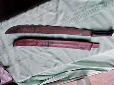 MACHETTI IN LEATHER SLEAVE
